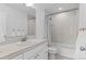 Bathroom features a large mirror, white vanity, and shower-tub combination with modern fixtures at 601 Morrison Dr, Frederick, CO 80530