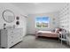 Bedroom featuring light pink bed, white dresser and an exterior view of the neighborhood at 601 Morrison Dr, Frederick, CO 80530