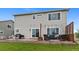 Back of home with patio, outdoor seating, and sliding doors to backyard for easy outdoor living at 601 Morrison Dr, Frederick, CO 80530