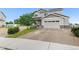 Charming two-story home with neutral siding, stone accents, an attached two car garage, and well manicured yard at 601 Morrison Dr, Frederick, CO 80530