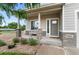 Inviting front porch with decorative stone pillars, a cozy bench, lush landscaping, and a welcoming entrance at 601 Morrison Dr, Frederick, CO 80530