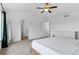 Bright main bedroom with a ceiling fan and entry to ensuite bathroom and closet at 601 Morrison Dr, Frederick, CO 80530