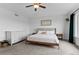 Spacious main bedroom with large windows and a modern dresser and matching nightstands at 601 Morrison Dr, Frederick, CO 80530