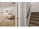 Basement bedroom with closet, carpet flooring, and a view to the stairwell at 7373 E Iowa Ave # 1108, Denver, CO 80231