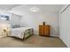 Cozy basement bedroom with carpet flooring, comfortable bed, and closet at 7373 E Iowa Ave # 1108, Denver, CO 80231