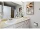Clean bathroom with white vanity, a large mirror, and a shower-tub combination at 7373 E Iowa Ave # 1108, Denver, CO 80231