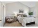 Cozy bedroom with a chair, large window, and a comfortable bed at 7373 E Iowa Ave # 1108, Denver, CO 80231