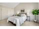 Well-lit bedroom featuring neutral tones, comfortable bedding, and closet at 7373 E Iowa Ave # 1108, Denver, CO 80231