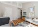 Bright Bedroom featuring a crib, toddler bed, storage, and a cozy teepee tent at 7373 E Iowa Ave # 1108, Denver, CO 80231