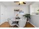 Bright dining room area with white marble table at 7373 E Iowa Ave # 1108, Denver, CO 80231