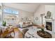 The dining room has a marble table, chairs, and a view to the living room at 7373 E Iowa Ave # 1108, Denver, CO 80231