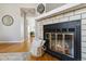 Fireplace with a basket and a view of the hallway at 7373 E Iowa Ave # 1108, Denver, CO 80231