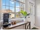 Cozy kitchen nook with coffee bar setup, a window, and a view of the backyard at 7373 E Iowa Ave # 1108, Denver, CO 80231