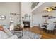 Cozy living room with a fireplace and lofted ceiling at 7373 E Iowa Ave # 1108, Denver, CO 80231