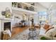 Cozy living room with a fireplace and hardwood floors at 7373 E Iowa Ave # 1108, Denver, CO 80231