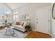 Open-concept living room with vaulted ceilings and large windows at 7373 E Iowa Ave # 1108, Denver, CO 80231