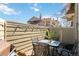 Relaxing outdoor patio with string lights, table and chairs, creating a perfect space for entertaining at 7373 E Iowa Ave # 1108, Denver, CO 80231