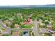Aerial view of home nestled within a lush, green community with mountain views at 7300 Beech St, Arvada, CO 80005