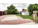 Well-maintained backyard featuring a storage shed, privacy fence, and patio space for outdoor enjoyment at 7300 Beech St, Arvada, CO 80005