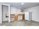 Unfinished basement area with a vintage refrigerator and space for storage or customization at 7300 Beech St, Arvada, CO 80005