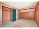 Carpeted bedroom with closet and doorway to another room, providing ample space at 7300 Beech St, Arvada, CO 80005
