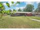 A well-maintained lawn and exterior view of a charming brick home with a small storage shed at 4715 Garland St, Wheat Ridge, CO 80033
