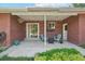 Brick patio with outdoor seating, flowers, and an inviting fire pit at 4715 Garland St, Wheat Ridge, CO 80033