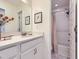 Bathroom boasts a modern vanity with quartz countertop and a shower and tub combo at 2507 Moline St, Aurora, CO 80010