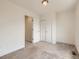 Neutral bedroom with plush carpeting, closet with sliding doors, and an attached bathroom at 2507 Moline St, Aurora, CO 80010