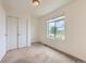 Bright bedroom features neutral carpet, closet with sliding doors, and great natural light at 2507 Moline St, Aurora, CO 80010