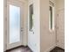 Welcoming entryway features modern wood floors, natural light, and convenient coat closet at 2507 Moline St, Aurora, CO 80010