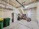 Spacious garage featuring ample storage shelving, overhead racks, and access to the home's interior at 2507 Moline St, Aurora, CO 80010
