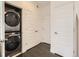 Convenient laundry room features a stacked washer and dryer unit and ample closet space at 2507 Moline St, Aurora, CO 80010