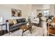 Inviting living area with hardwood floors, modern decor, and natural lighting at 2507 Moline St, Aurora, CO 80010