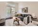 Cozy living area with hardwood floors, neutral tones, and modern accents at 2507 Moline St, Aurora, CO 80010