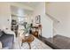 Open-concept living room flows into modern kitchen with island and stainless steel appliances at 2507 Moline St, Aurora, CO 80010