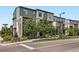 Modern townhome complex with mature landscaping, sidewalks, and street parking at 2507 Moline St, Aurora, CO 80010
