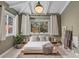 Inviting bedroom featuring a stylish bed, warm lighting, and a tranquil, comfortable setting at 3209 E Yale Way, Denver, CO 80210