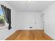 Minimalist bedroom showcasing hardwood floors, bright walls, and a modern, spacious feel at 3209 E Yale Way, Denver, CO 80210