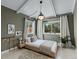 Charming bedroom featuring a modern bed, sleek lighting, and a bright, airy atmosphere at 3209 E Yale Way, Denver, CO 80210
