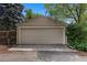 Detached garage with neutral paint and concrete driveway at 3209 E Yale Way, Denver, CO 80210