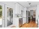 Bright kitchen with stainless steel appliances and door to backyard at 3209 E Yale Way, Denver, CO 80210