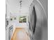 Contemporary kitchen with stainless steel appliances, hardwood floors, and natural light at 3209 E Yale Way, Denver, CO 80210