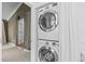 Convenient laundry area with stacked washer and dryer units at 3209 E Yale Way, Denver, CO 80210