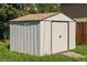 Durable metal backyard shed with a single access door and a neutral color at 11917 Lavinia Way, Northglenn, CO 80233