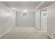 Spacious carpeted basement with light gray walls and trim and natural light at 11917 Lavinia Way, Northglenn, CO 80233