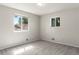 Comfortable bedroom with neutral walls, plush carpeting, and bright, airy windows at 11917 Lavinia Way, Northglenn, CO 80233