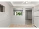 Bright dining room with neutral walls, linoleum floors, and view to kitchen at 11917 Lavinia Way, Northglenn, CO 80233