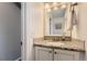 Charming bathroom features a granite countertop, vanity, and bright lighting at 4222 S Himalaya Way, Aurora, CO 80013