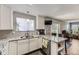 Stylish kitchen with granite countertops, stainless steel appliances, and open layout to the dining area at 4222 S Himalaya Way, Aurora, CO 80013